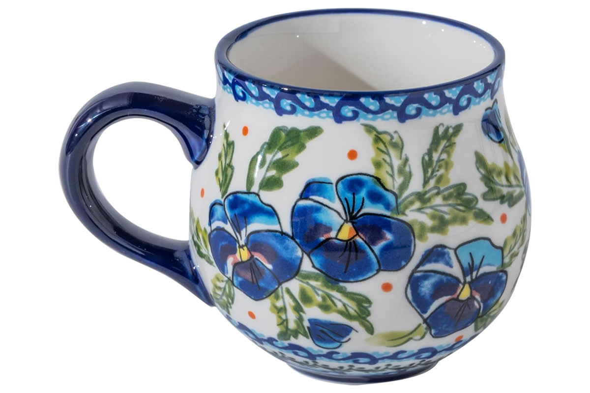Handcrafted coffee mug with hand painted blue daisies and blue handle.