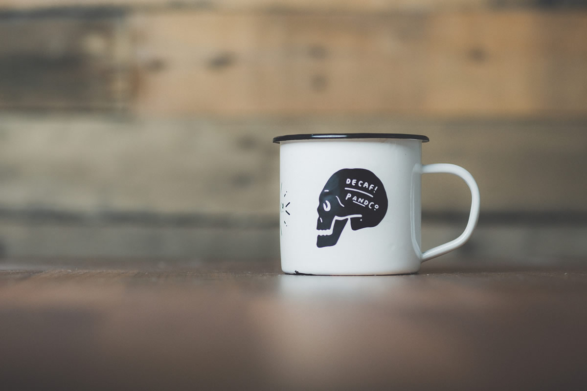 Mug with a bold drawing of a skull.