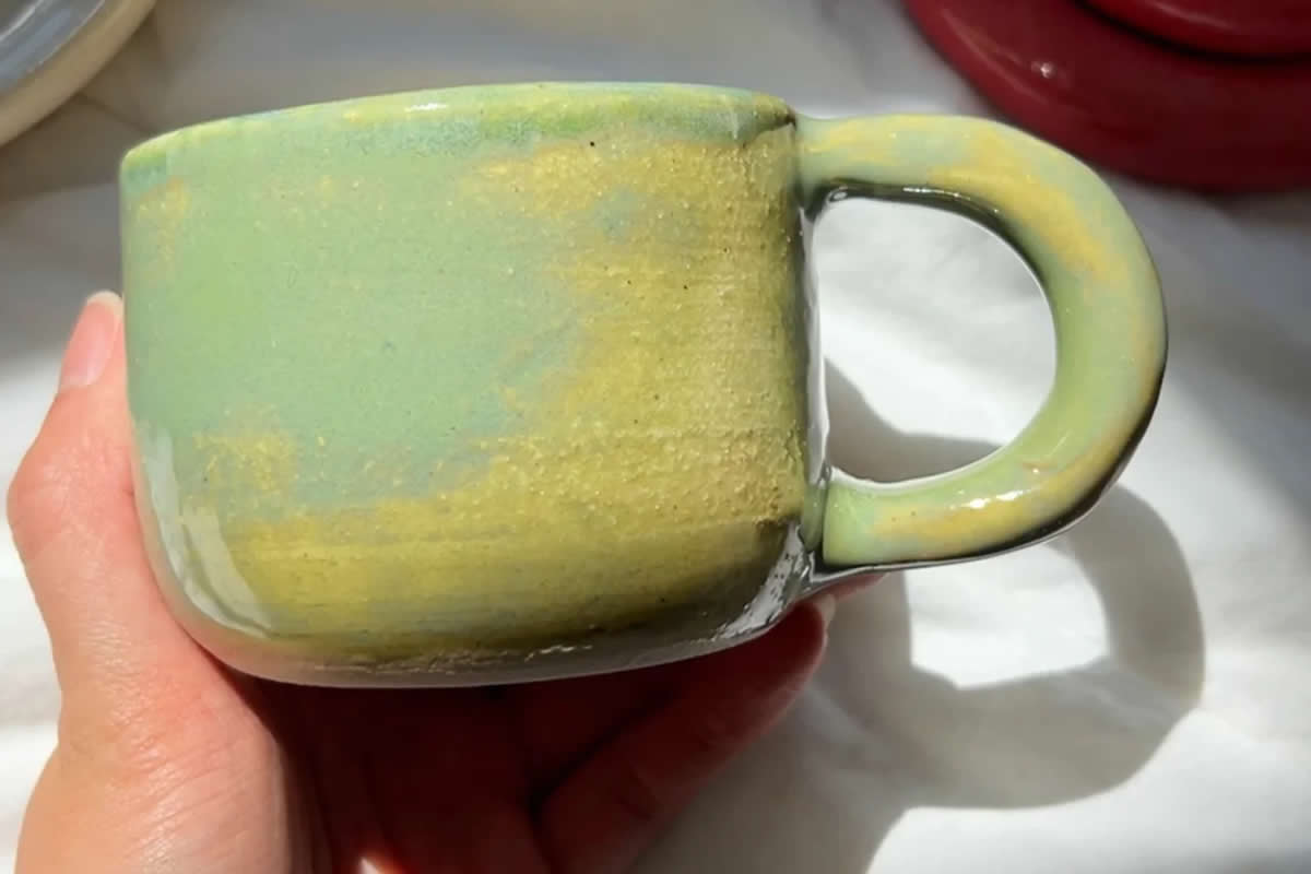 Uncomfy. Green Radish merch mug.